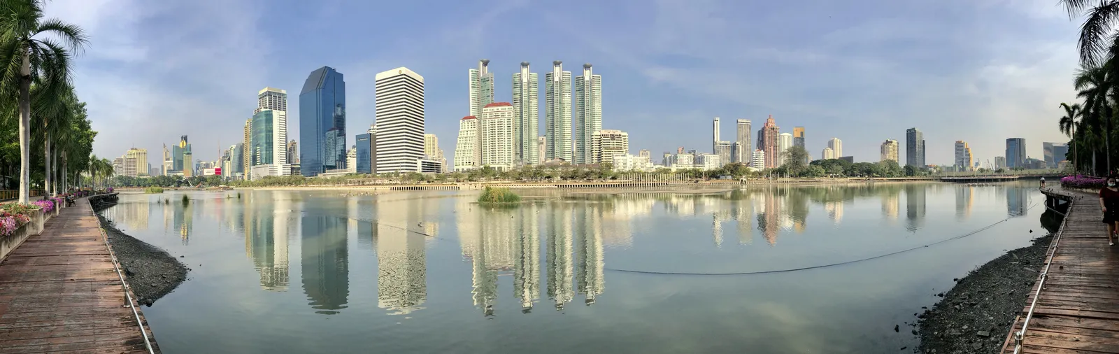 Boardwalk and skyline view at Benchakitti Park in Bangkok