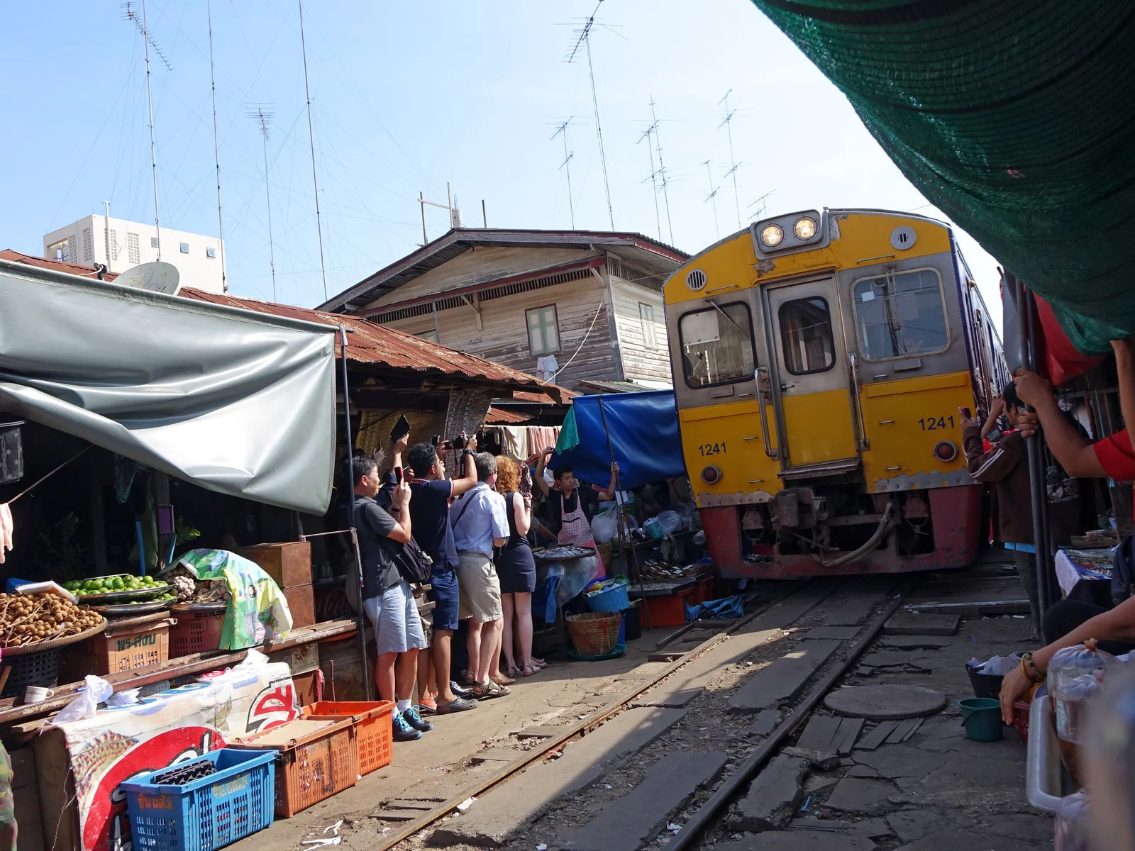A train passing through Maeklong Railway Market near Bangkok