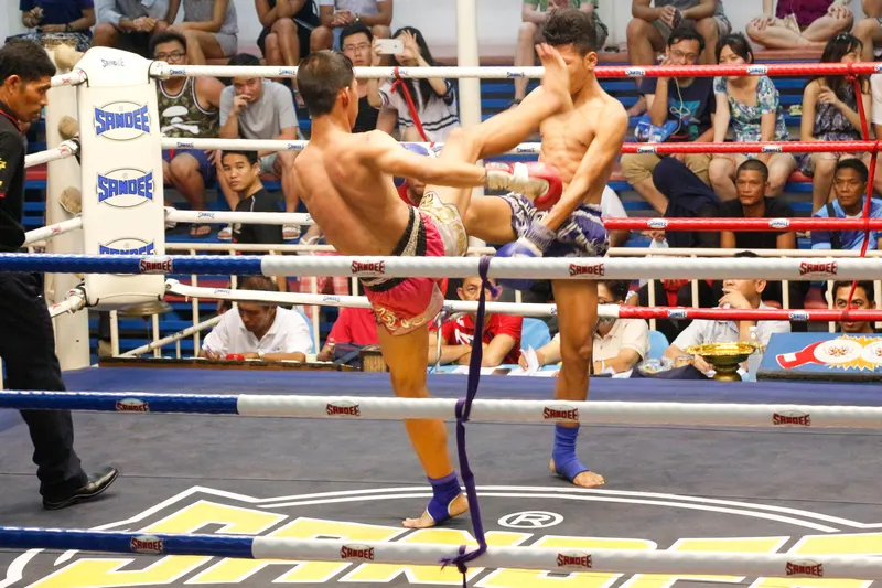 Muay Thai fighters in a Bangkok stadium ring