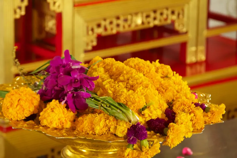 A marigold garland offering at a Bangkok temple