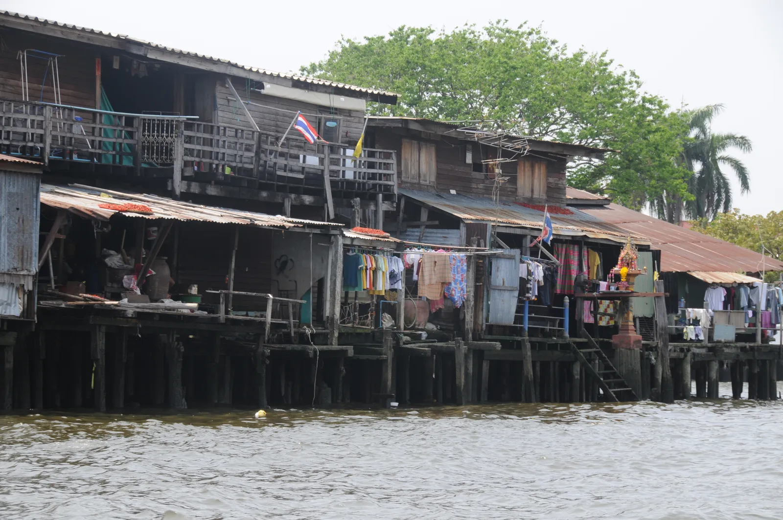 Traditional canal houses along a Thonburi waterway in Bangkok