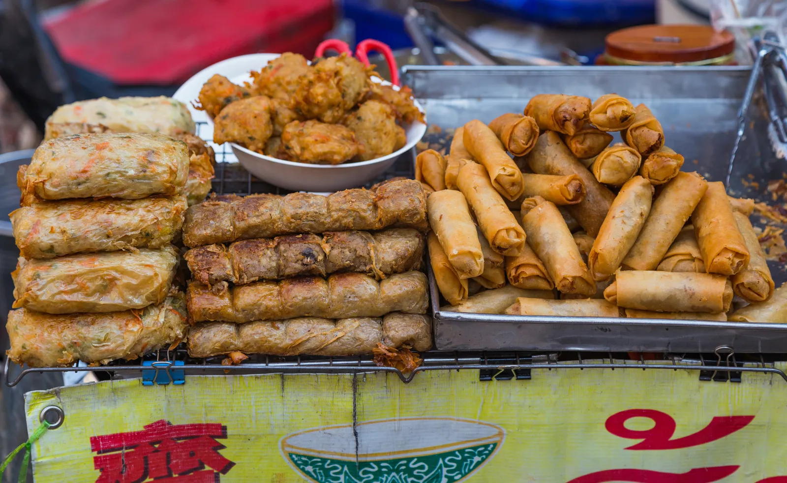 Busy street-food counter on Yaowarat Road in Bangkok Chinatown